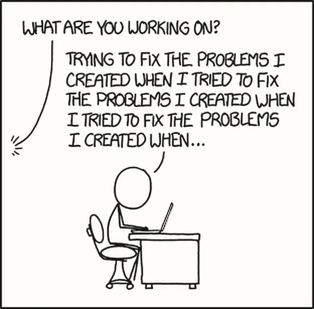 Một người ngồi trước laptop. Hỏi: What are you working on? Đáp: Trying to fix the problems I created when I tried to fix the problems I created when I tried to fix the problems I created when…